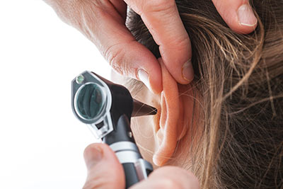 Doctor Checking Patient's Ear