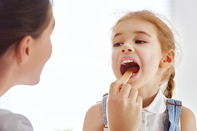 Doctor with Pediatric Patient